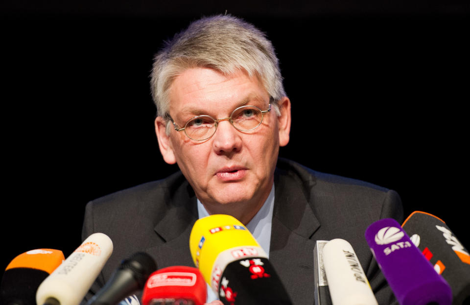 Prosecutor Horst Bien attends the press conference in Duisburg, Germany, Wednesday Feb. 12, 2014. German prosecutors say they have indicted 10 people on charges including involuntary manslaughter over a mass panic at the Love Parade techno music festival nearly four years ago that resulted in 21 deaths. Duisburg prosecutor Horst Bien said Wednesday that four employees of the event's organizers and six city workers have been indicted. They face charges of involuntary manslaughter and bodily harm, punishable with up to five years jail time. (AP Photo/dpa, Jan-Philipp Strobel)