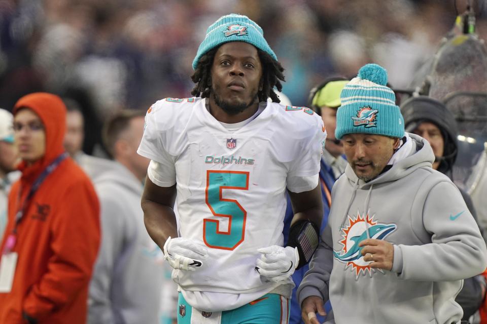 Miami Dolphins quarterback Teddy Bridgewater (5) walks on the sideline after an apparent injury during the second half of an NFL football game against the New England Patriots, Sunday, Jan. 1, 2023, in Foxborough, Mass. (AP Photo/Steven Senne)
