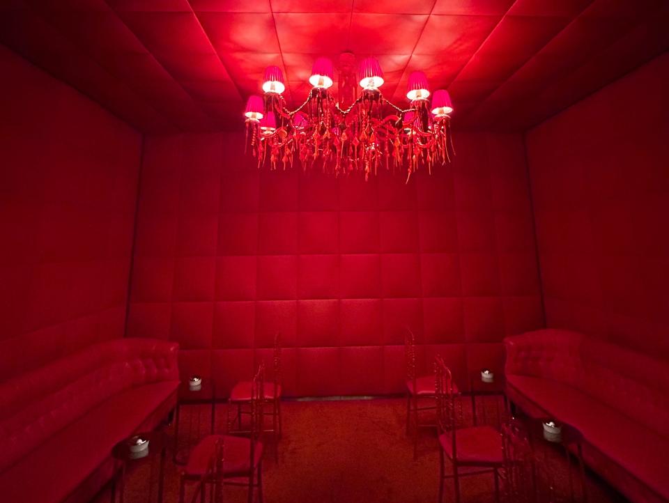 A deep red smoking room in Le Royal Monceau.