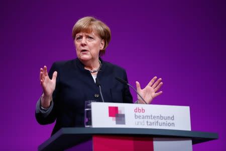 German Chancellor Angela Merkel delivers a speech during the yearly meeting of Germany's government workers union Deutscher Beamtenbund (dbb) in Cologne, Germany January 9, 2017. REUTERS/Wolfgang Rattay