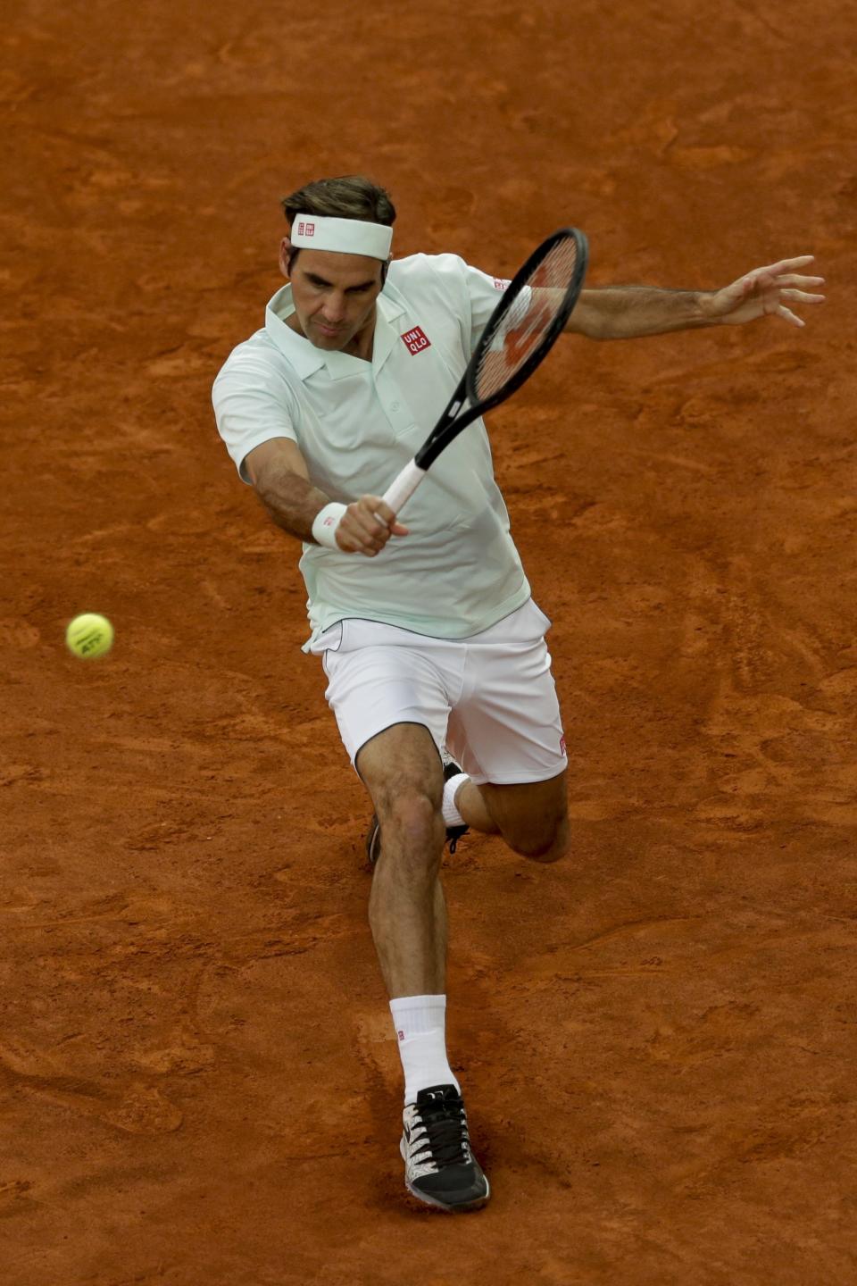 Roger Federer returns the ball to Richard Gasquet during the Madrid Open tennis tournament in Madrid, Tuesday, May 7, 2019. (AP Photo/Bernat Armangue)