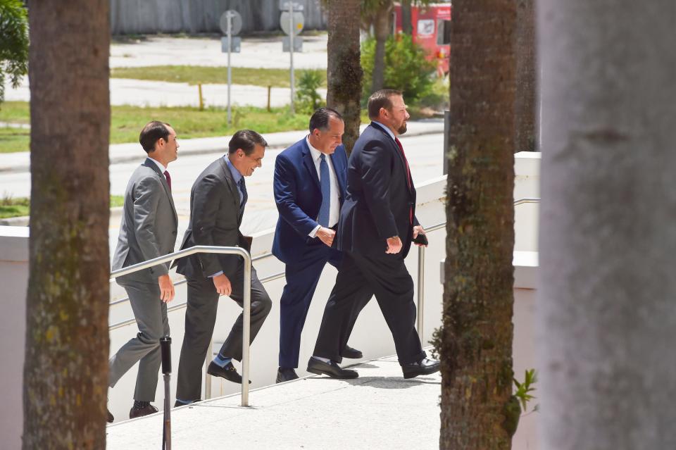 Some of former President Donald Trump's legal team arrive on U.S. 1 in front of the Alto Lee Adams Sr. U.S. Courthouse in Fort Pierce on July 18, 2023.