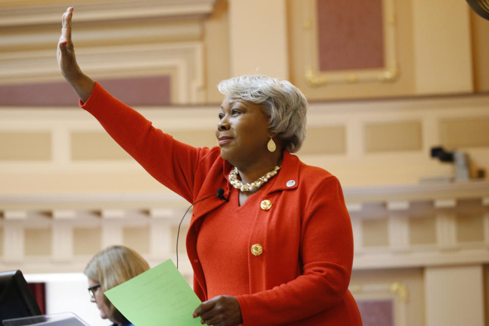 Senate President Pro Tempore, Sen. Louise Lucas, D-Portsmouth, recognizes a visitor in the gallery as she presides over the Senate at the Capitol, Monday Jan 27, 2020, in Richmond, Va. (AP Photo/Steve Helber)