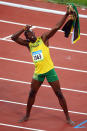 Usain Bolt of Jamaica celebrates winning the Men's 100m Final and the gold medal at the National Stadium on Day 8 of the Beijing 2008 Olympic Games on August 16, 2008 in Beijing, China. Bolt finished the event in first place with a time of 9.69, a new World Record. (Photo by Mike Hewitt/Getty Images)