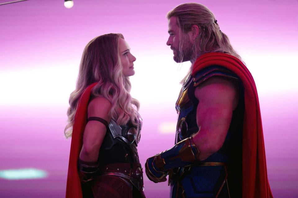 Thor and Natalie Portman as Lady Thor staring at each other
