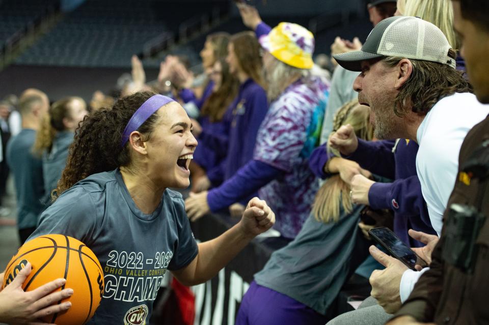 Tennessee Tech’s Peyton Carter (22) celebrates with the parents of the Golden Eagles following their 54-46 victory over the Little Rock Trojans in the OVC women's championship at Ford Center on Saturday, March 4, 2023.