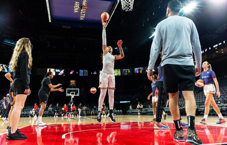 Phoenix Mercury center Brittney Griner, center, warms up before Game 5 of the team's WNBA basketball playoff series against the Las Vegas Aces on Friday, Oct. 8, 2021, in Las Vegas.