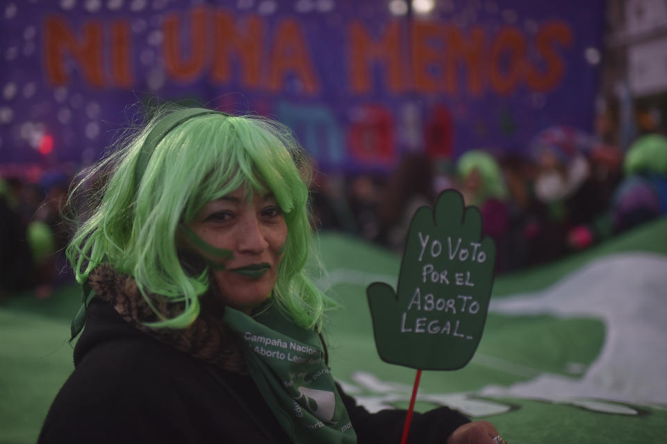 A woman shows a sign that reads 'I vote in favour of legal abortion' during a protest as part of the 'Not One Less' (Ni Una Menos) movement demanding legal abortion on June 04, 2018 in Buenos Aires, Argentina.