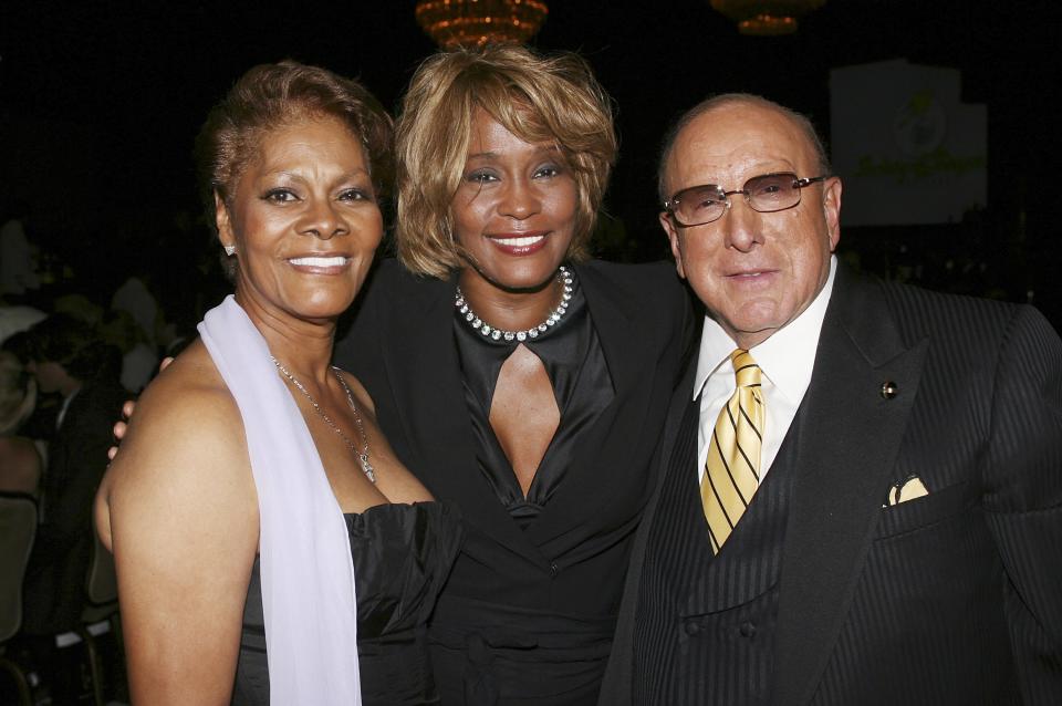 Dionne Warwick, Whitney Houston and producer Clive Davis posing for picture 