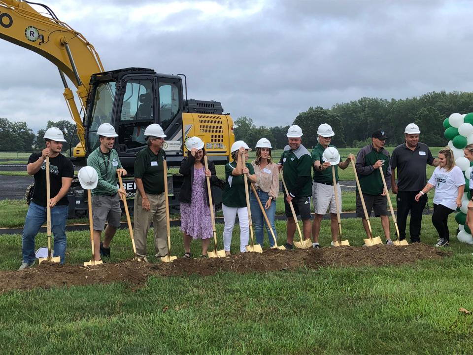 Northridge coaches, administrators and other district personnel break ground Tuesday evening for the new Viking Stadium.
