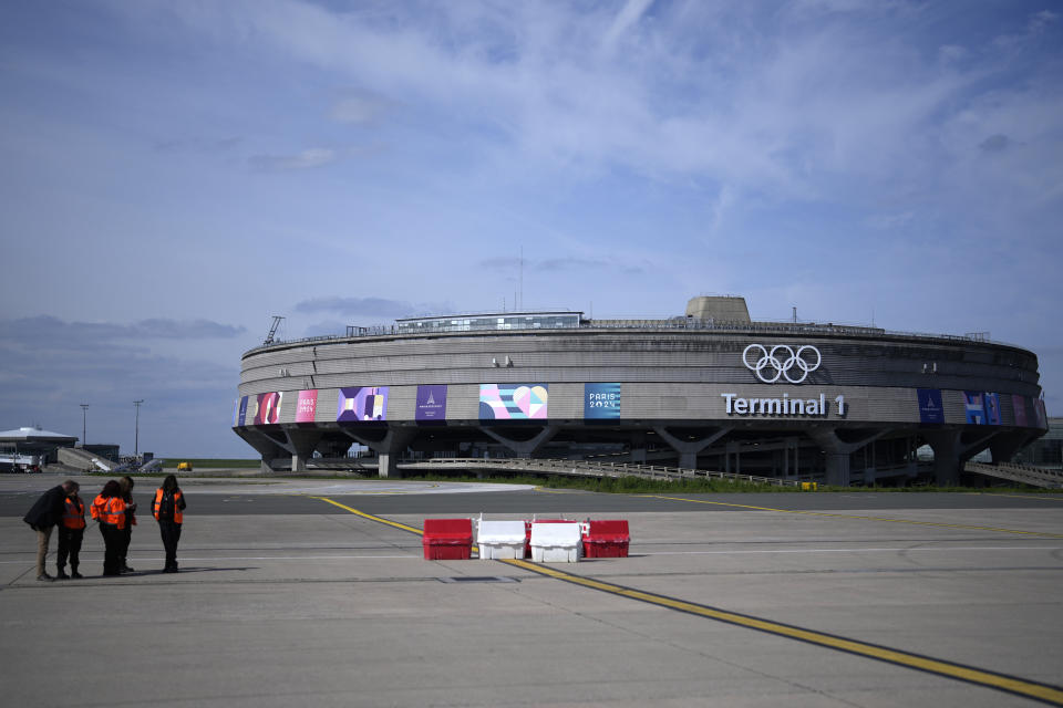 The Charles de Gaulle airport, terminal 1, where the olympic rings were installed, is seen in Roissy-en-France, north of Paris, Tuesday, April 23, 2024 in Paris. (AP Photo/Thibault Camus)