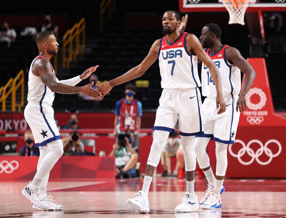 Kevin Durant, left, and Damian Lillard celebrate during the preliminary round victory over Iran on Wednesday.