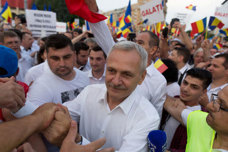 Romania's ruling Social Democratic Party leader Liviu Dragnea is greeted by supporters during a demonstration in Bucharest, Romania, June 9, 2018. Inquam Photos/Liviu Florin Albei via REUTERS