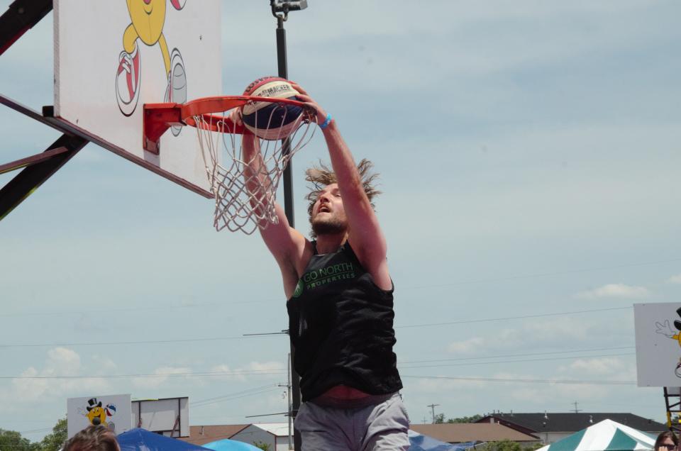 Joey Brunk throws down a dunk during a matchup at the Gaylord Gus Macker on Saturday, June 25 at the Otsego County Sportsplex in Gaylord.