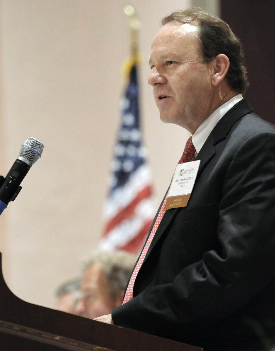 CORRECTS CAPTION TO SAY THAT JUDGE SAYS HE WILL ORDER OHIO TO RECOGNIZE OUT OF STATE GAY MARRIAGES INSTEAD OF STRIKING DOWN GAY MARRIAGE BAN - FILE - In this April 2009 file photo photo provided by the Cincinnati Bar Association, federal Judge Timothy Black accepts an award from the bar for his involvement in the community. Black on Friday, April 4, 2014 said he will strike down part of Ohio's voter-approved ban on gay marriage, meaning the state must recognize marriages of gay couples who legally wed elsewhere. Black made the statement following final arguments in a lawsuit that challenged the constitutionality of the marriage ban. (AP Photo/Cincinnati Bar Association, File)