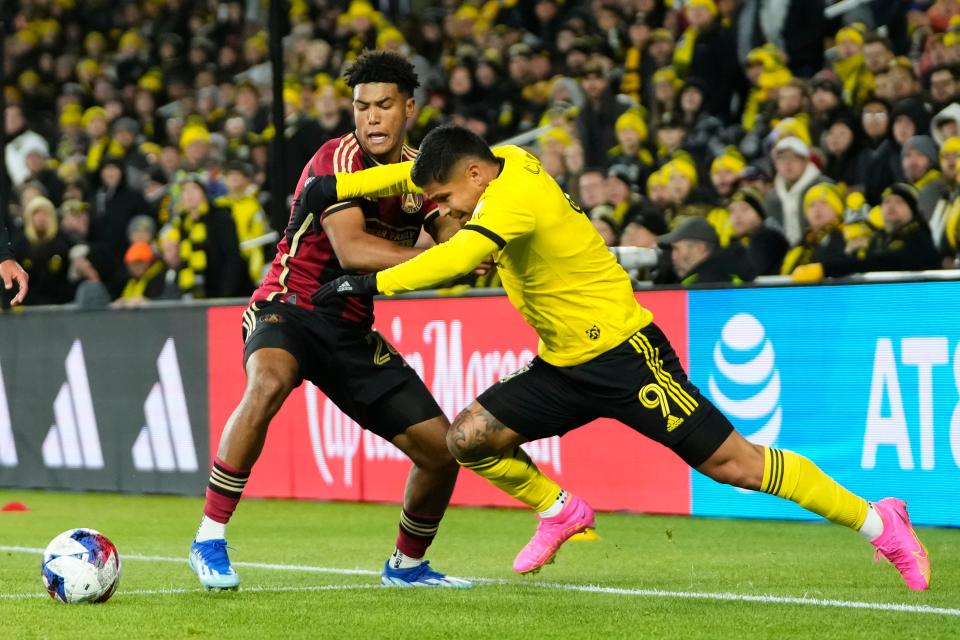 Nov 1, 2023; Columbus, Ohio, USA; Columbus Crew forward Cucho Hernandez (9) fights for the ball with Atlanta United defender Caleb Wiley (26) during the second half of the first round MLS Cup Playoffs matchup at Lower.com Field. The Crew won 2-0.