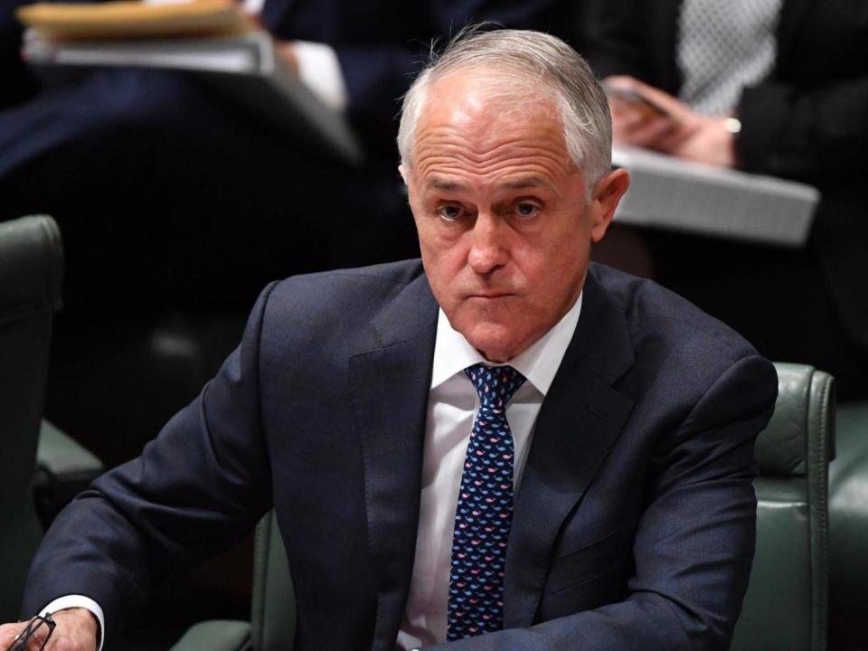 Malcolm Turnbull tells MPs his government has dropped plans to put an emissions reduction target into legislation (EPA)