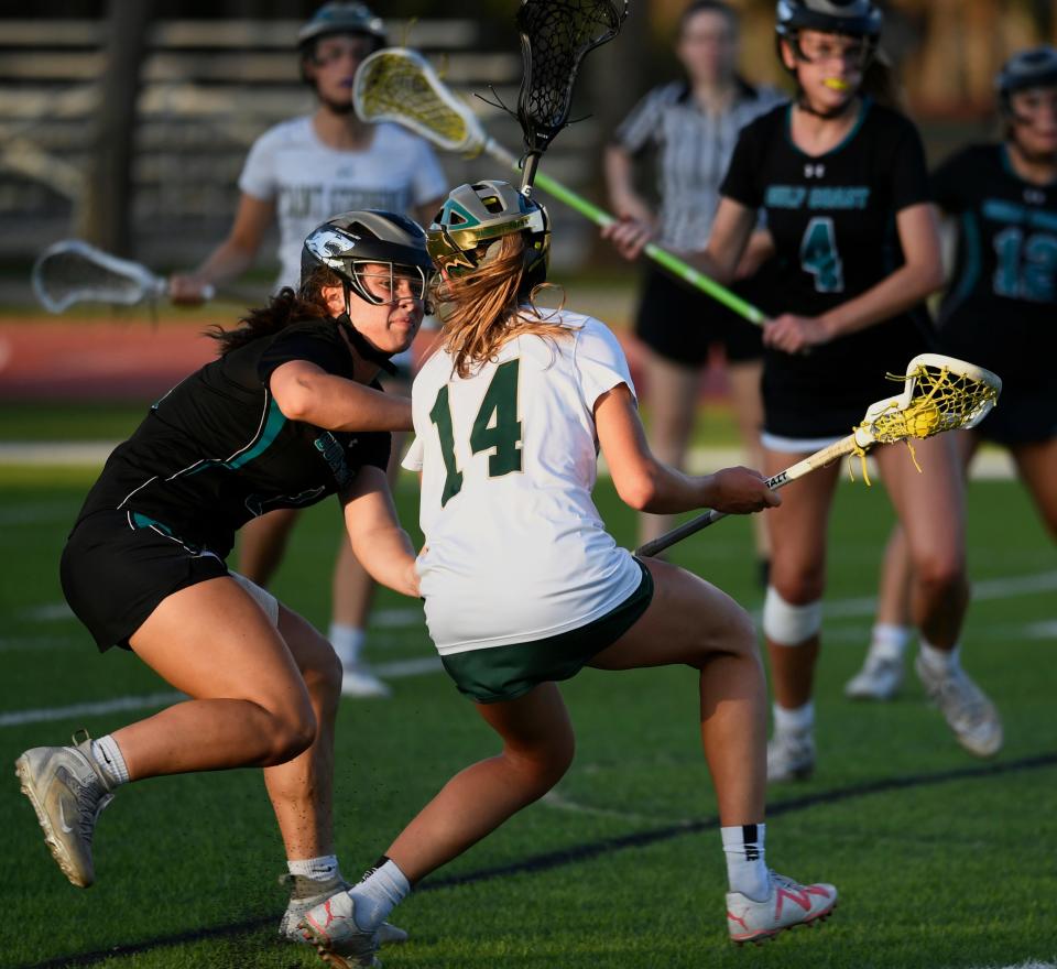 Saint Stephen's Ashling Marshall tries to advance past the defense of Gulf Coast's Nolan Nanke on Tuesday during a Class 1A-Region 3 lacrosse semifinal at Saint Stephen's.