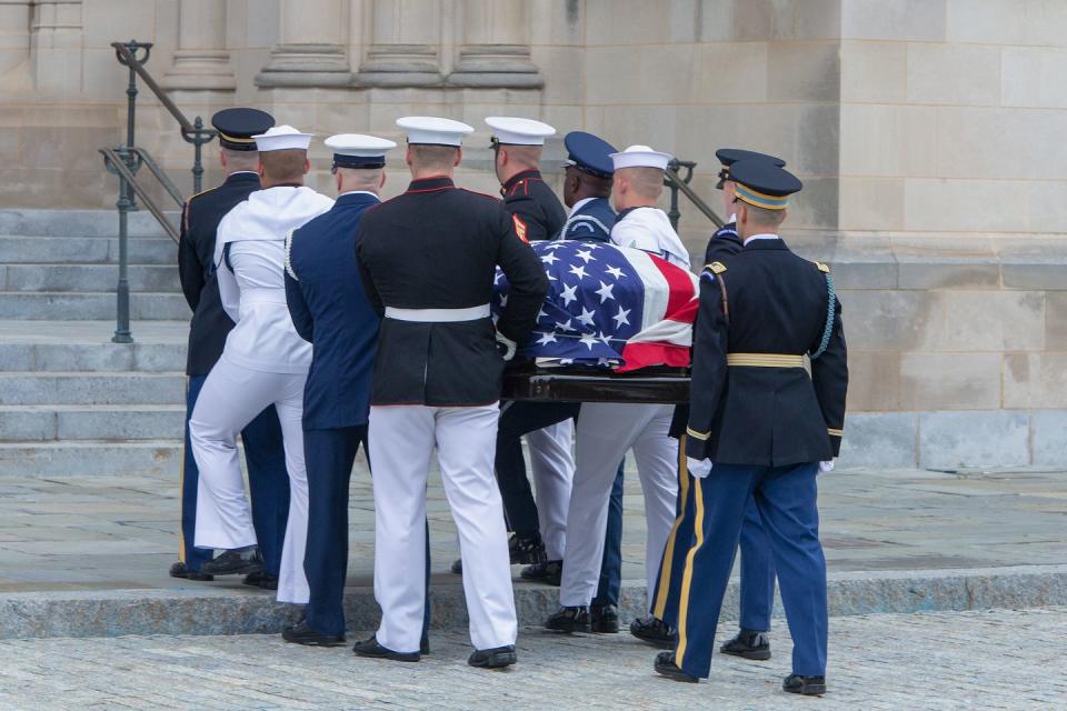 12) Honor Guards carry John McCain's casket into the National Cathedral.