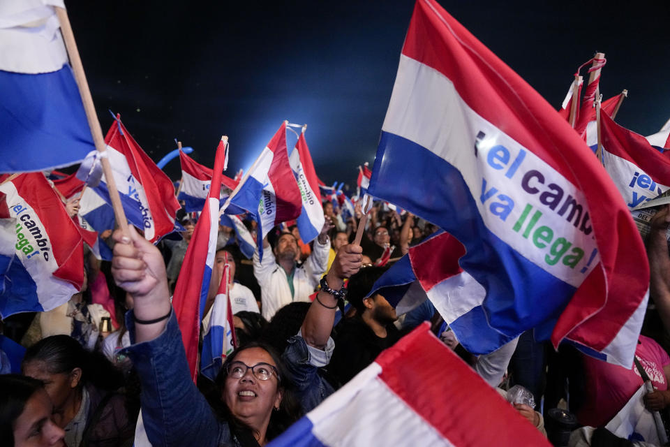 Followers of Efrain Alegre, presidential candidate for the Concertacion coalition, wave Paraguayan flags during Alegre´s closing campaign rally in Asuncion, Paraguay, Thursday, April 27, 2023. Paraguay's general elections are scheduled for April 30th. (AP Photo/Jorge Saenz)