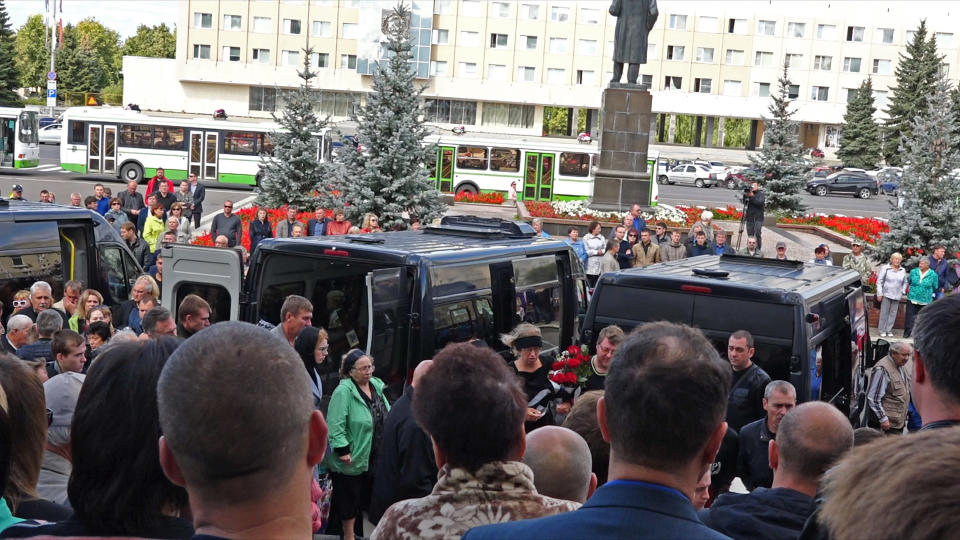 In this grab taken from a footage provided by the Russian State Atomic Energy Corporation ROSATOM press service, people gather for the funerals of five Russian nuclear engineers killed by a rocket explosion in Sarov, the closed city, located 370 kilometers (230 miles) east of Moscow, Monday, Aug. 12, 2019. Thousands of people have attended the burial of five Russian nuclear engineers killed by an explosion during tests of a new rocket. The engineers, who died on Thursday, were laid to rest Monday in the city of Sarov that hosts Russia’s main nuclear weapons research center. (Russian State Atomic Energy Corporation ROSATOM via AP)