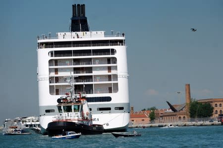 The cruise ship MSC Opera loses control and crashes against a smaller tourist boat at the San Basilio dock in Venice