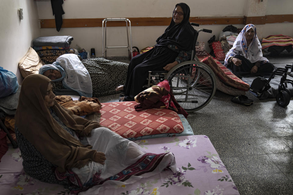 Palestinians take shelter from the Israeli bombardment at a school in Khan Younis, in the Gaza Strip, on Monday, Oct.16, 2023. (AP Photo/Fatima Shbair)