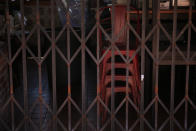 Dining chairs are seen stacked up at a restaurant temporarily closed due to the coronavirus pandemic in Los Angeles, Monday, July 6, 2020. (AP Photo/Jae C. Hong)