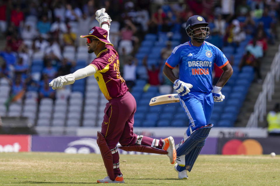 West Indies' Nicholas Pooran celebrates the dismissal of India's Sanju Samson during their first T20 cricket match at the Brian Lara Stadium in Tarouba, Trinidad and Tobago, Thursday, Aug. 3, 2023. (AP Photo/Ramon Espinosa)