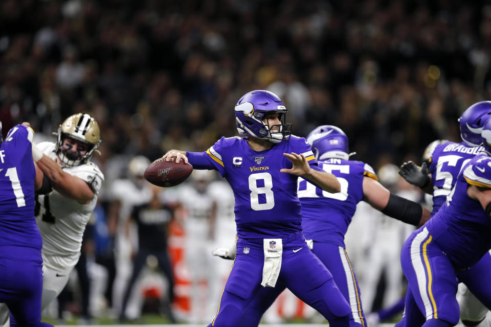Minnesota Vikings quarterback Kirk Cousins (8) passes in the first half of an NFL wild-card playoff football game against the New Orleans Saints, Sunday, Jan. 5, 2020, in New Orleans. (AP Photo/Brett Duke)