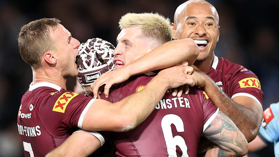 Daly Cherry-Evans, Cameron Munster and Felise Kaufusi, pictured here after Queensland's win in State of Origin I.