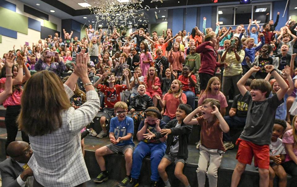 Dr. Brenda Kelley, Superintendent of Anderson School District Five, cheers with students and faculty during the announcement of North Pointe Elementary School as one of the 2023-24 Palmetto's Finest schools, in the school auditorium in Anderson, S.C. April 23, 2024.