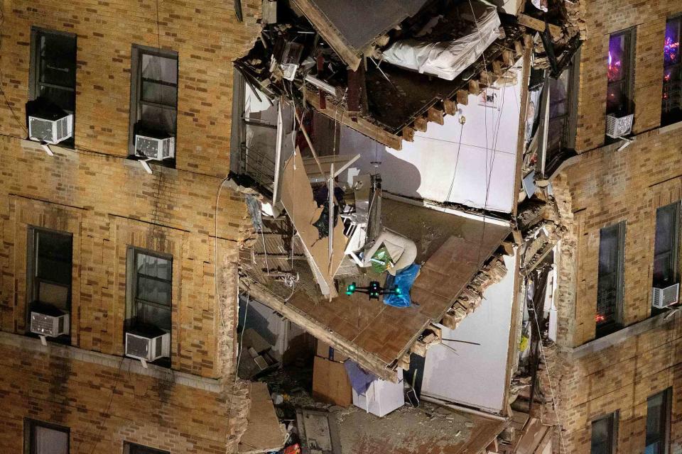 <p>Gardiner Anderson for NY Daily News via Getty </p> A drone searches for victims after the partial building collapse in the Bronx