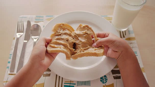 PHOTO: In an undated stock photo, a kid is seen pulling apart a peanut butter sandwich. (STOCK PHOTO/Getty Images)