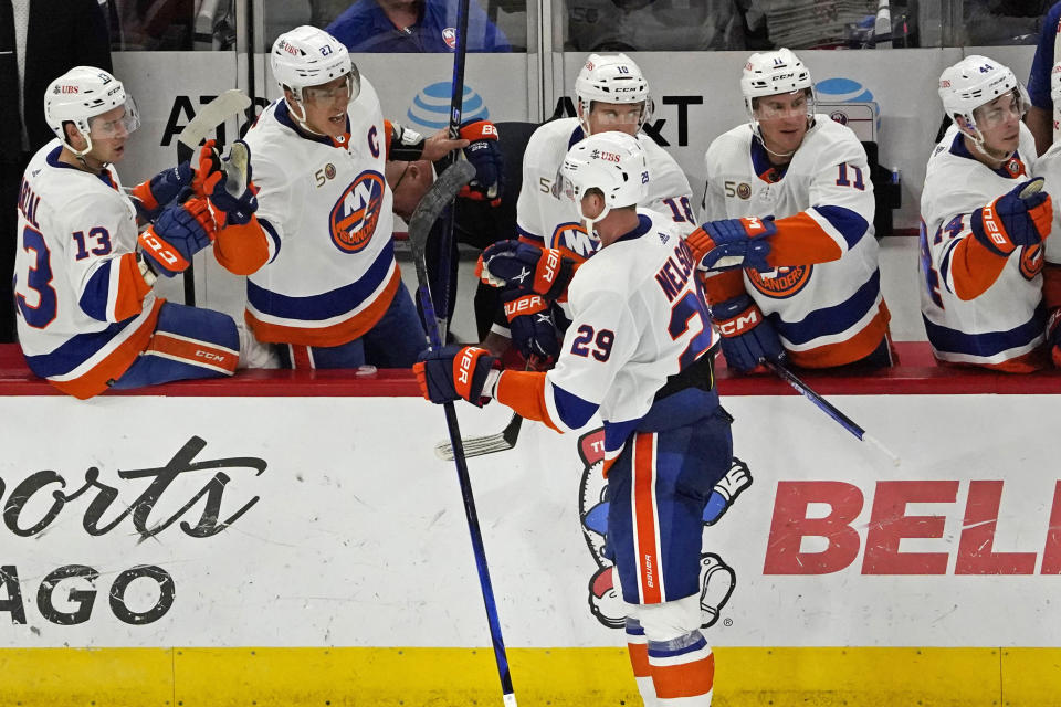 New York Islanders center Brock Nelson (29) is congratulated for his goal against the Chicago Blackhawks during the third period of an NHL hockey game Tuesday, Nov. 1, 2022, in Chicago. (AP Photo/David Banks)