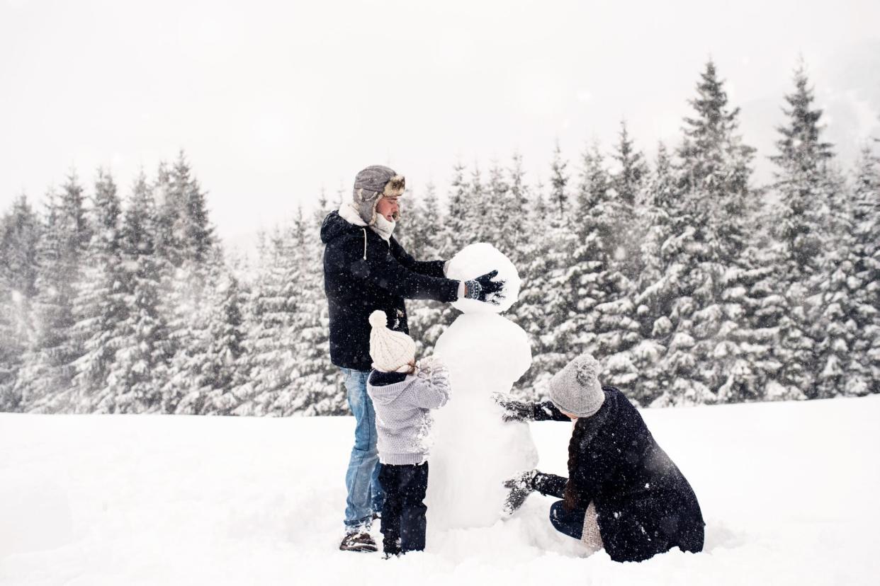 Family building snowman