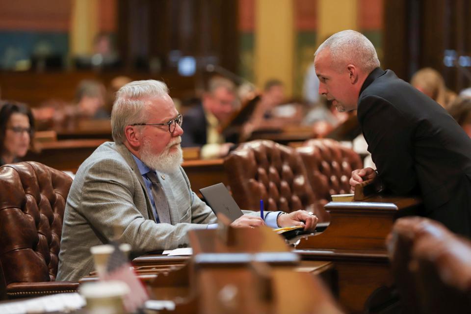 State Rep. Jack O'Malley, R-Lake Ann in conversation with State Rep. Jason Wentworth, R-Farwell during the House session at the Michigan State Capitol in Lansing on Tuesday, June 14 2022. 