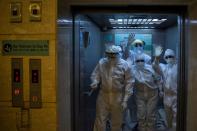 Medical workers treat patients infected with the coronavirus disease (COVID-19) at a hospital in New Delhi