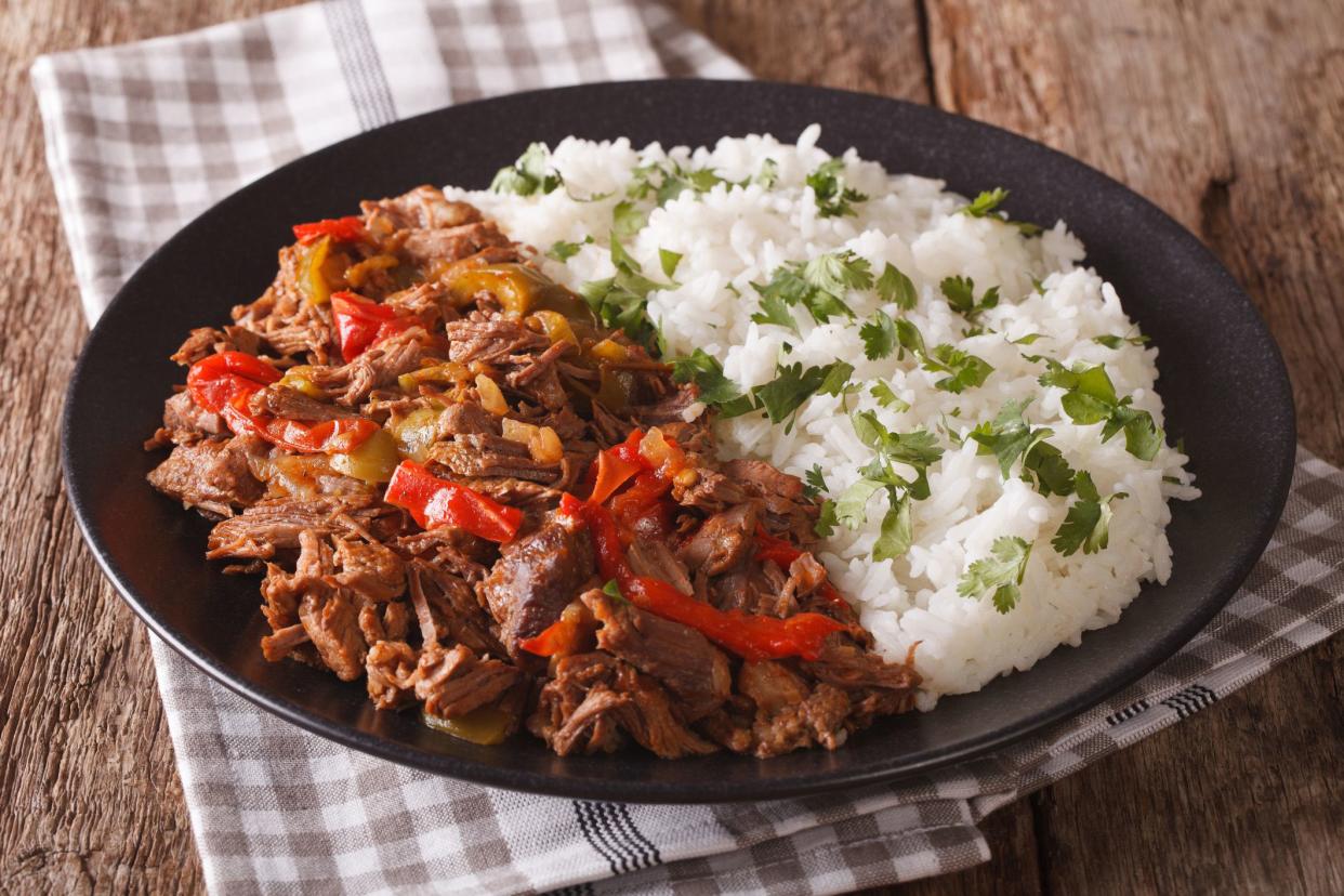 ropa vieja and white rice on plate