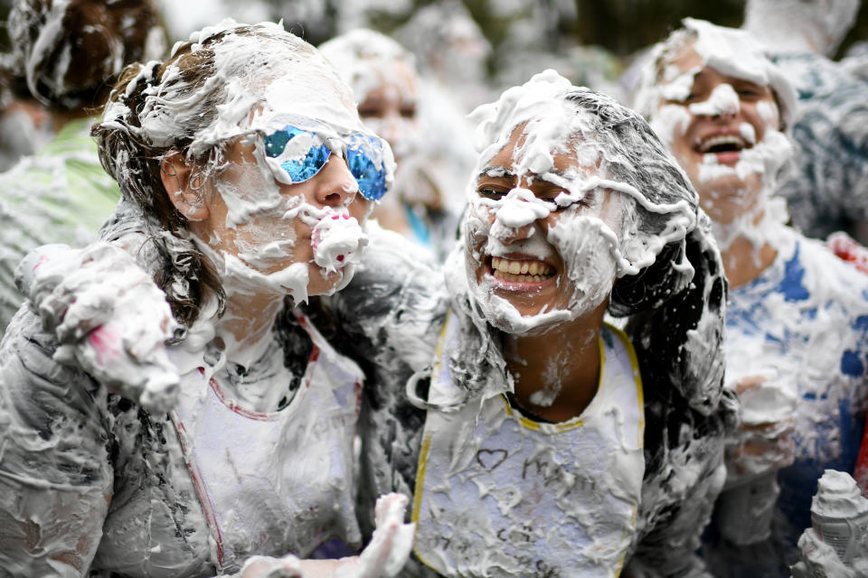 <p>Students from St Andrews University indulge in a tradition of covering themselves with foam to honor the “academic family” on Lower College Lawn on Oct. 23, 2017, in St Andrews, Scotland. (Photo: Jeff J Mitchell/Getty Images) </p>