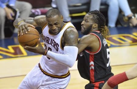 May 25, 2016; Cleveland, OH, USA; Cleveland Cavaliers forward LeBron James (23) drives against Toronto Raptors forward DeMarre Carroll (5) in the second quarter in game five of the Eastern conference finals of the NBA Playoffs at Quicken Loans Arena. Mandatory Credit: David Richard-USA TODAY Sports