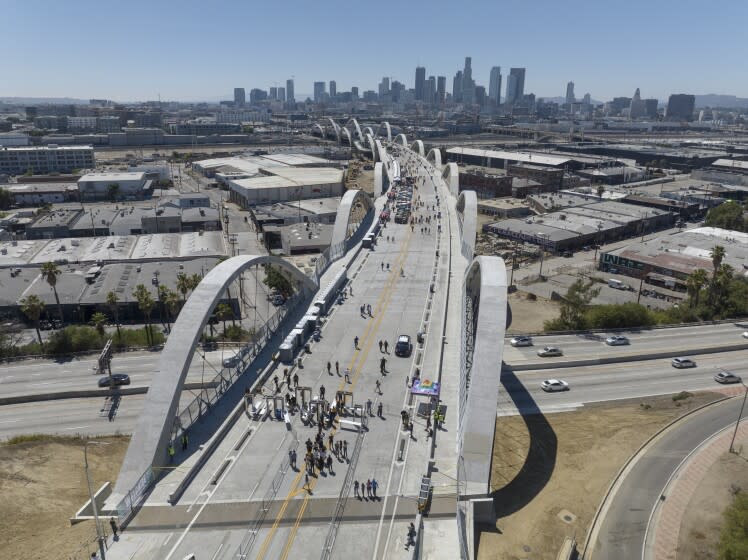 LOS ANGELES, CA - JULY 09: The 6th Street Viaduct was open to pedestrians during a community celebration on Saturday, July 09, 2022. The $588-million project took more than six years to complete. The weekend celebration featured live music, food, a market, vintage car display and a fireworks show on Saturday night. The bridge will officially open to cars on Sunday at 7 p.m. (Myung J. Chun / Los Angeles Times)