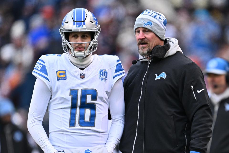 Dec 10, 2023; Chicago, Illinois, USA; Detroit Lions head coach Dan Campbell talks with quarterback Jared Goff (16) in the first half against the Chicago Bears at Soldier Field. Mandatory Credit: Jamie Sabau-USA TODAY Sports ORG XMIT: IMAGN-710698 ORIG FILE ID: 20231210_neb_qt0_127.JPG