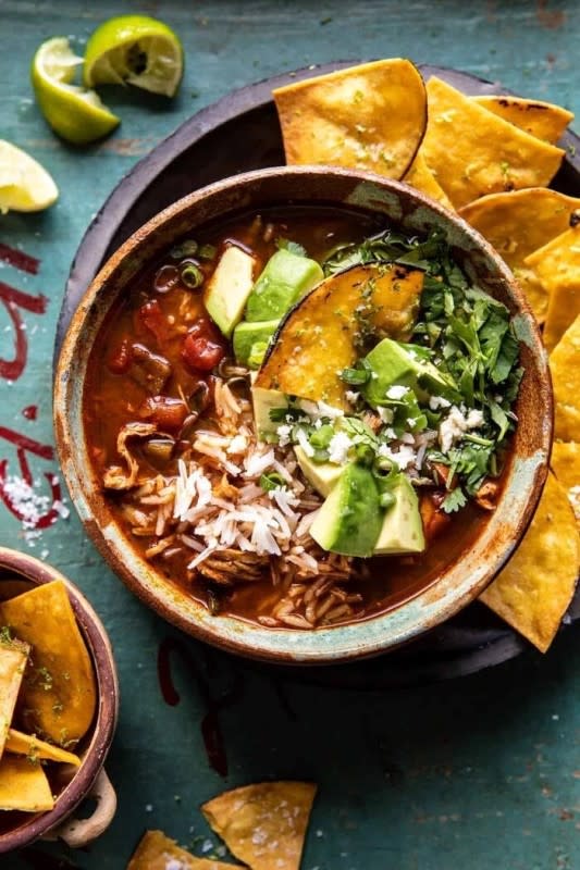 <p>Half Baked Harvest</p><p>Made with fire-roasted tomatoes, chipotle chili powder, and shredded chicken, this soup is hearty but healthy and so delicious. </p><p><strong>Get the recipe: <a href="https://www.halfbakedharvest.com/chipotle-chicken-and-avocado-rice-soup/" rel="nofollow noopener" target="_blank" data-ylk="slk:Slow Cooker Chipotle Chicken and Avocado Rice Soup;elm:context_link;itc:0;sec:content-canvas" class="link rapid-noclick-resp">Slow Cooker Chipotle Chicken and Avocado Rice Soup</a></strong></p>