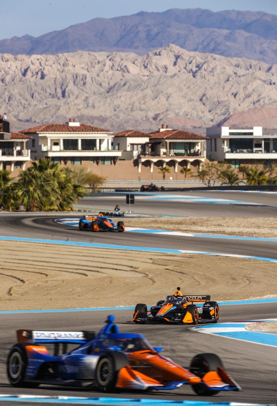 Pato O'Ward of Arrow McLaren (middle) rounds turn 13 ahead of teammate Felix Rosenqvist and behind Scott Dixon of Chip Ganassi Racing during day two of NTT IndyCar Series open testing at The Thermal Club in Thermal, Calif., Friday, Feb. 3, 2023.