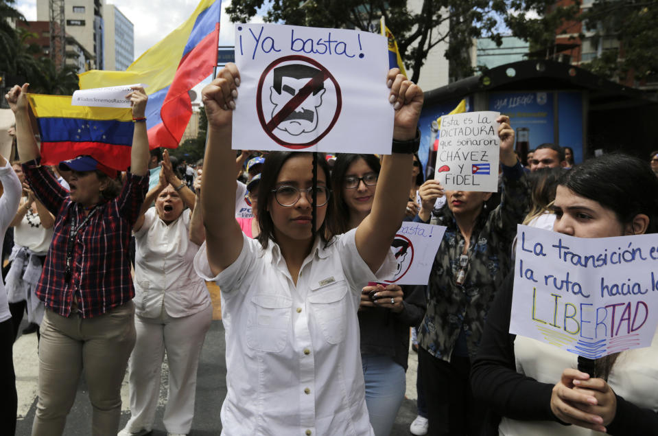 A woman protests against the blocking of supplies to Venezuela. Source: AP