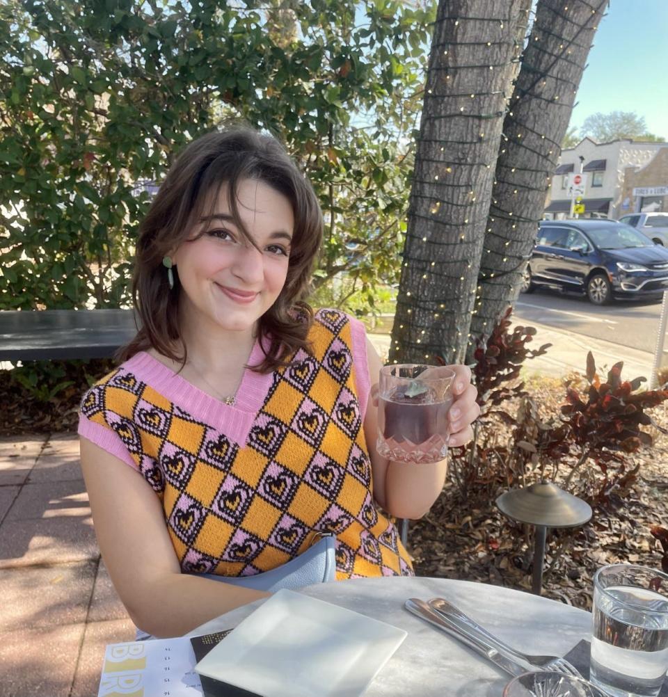 Caroline Hebert poses for a photo while enjoying brunch.