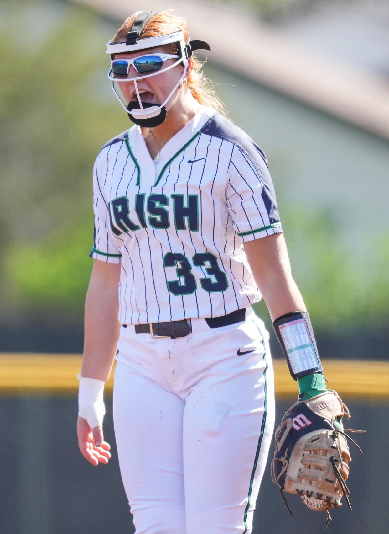 Cathedral Fighting Irish Maddie Liter (33) yells in excitement Saturday, April 13, 2024, during the game at the Cathedral High School in Indianapolis.