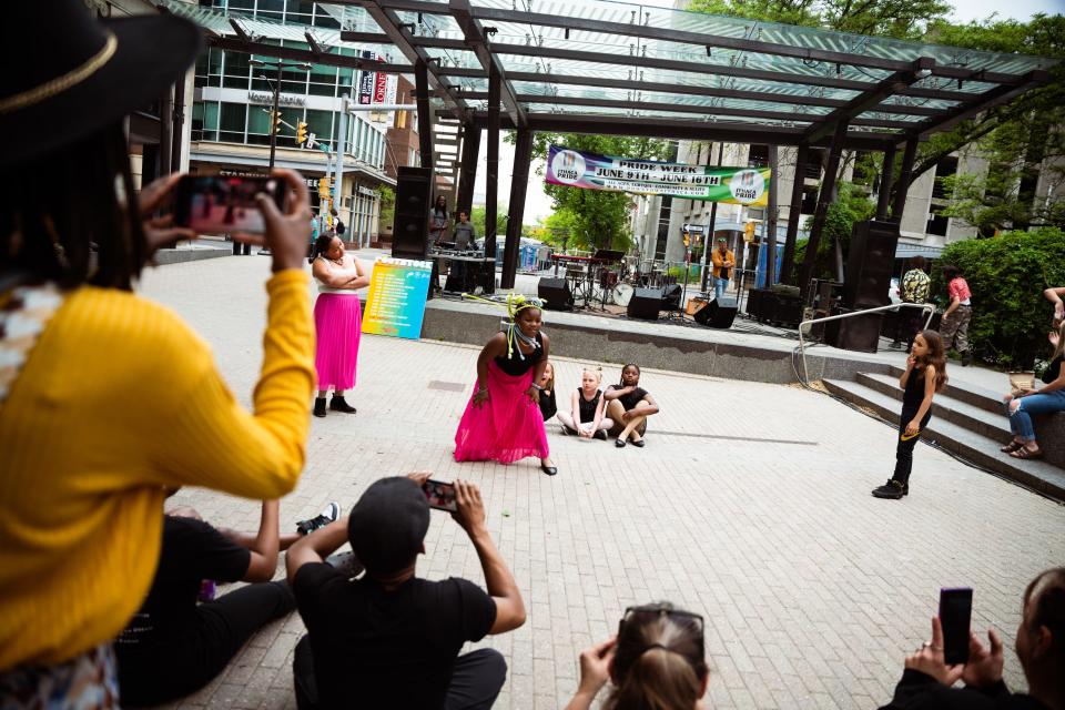 Children dance and pose on the Ithaca Commons for a previous Rootstock event