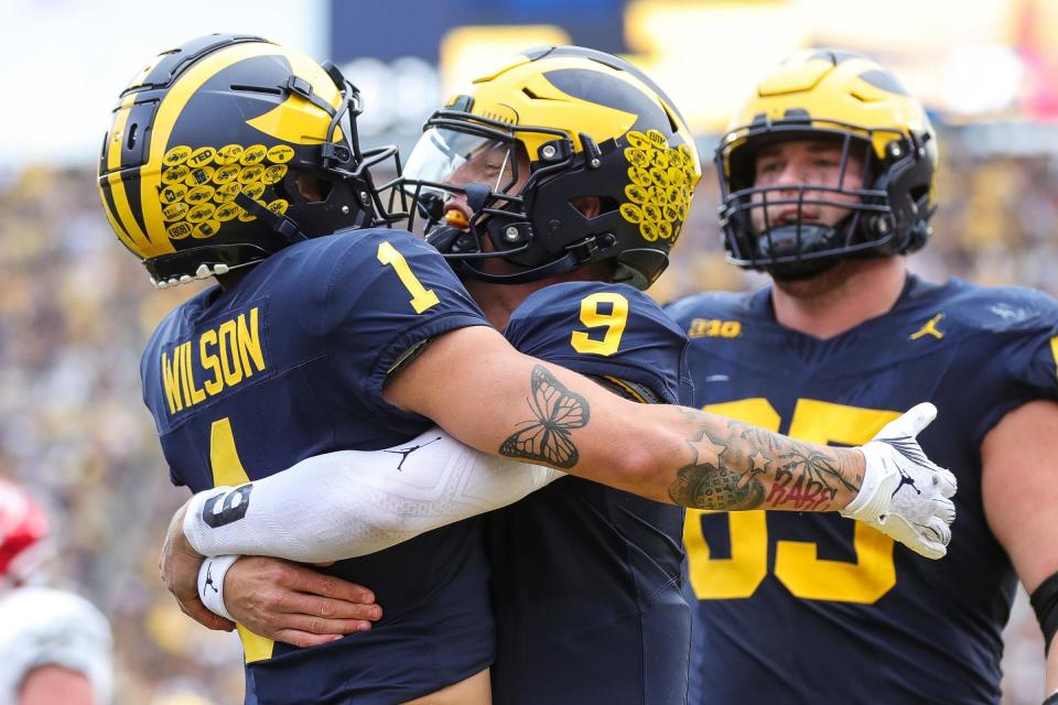 Michigan wide receiver Roman Wilson (1) celebrates a touchdown against UNLV with quarterback J.J. McCarthy (9) during the second half at Michigan Stadium in Ann Arbor on Saturday, Sept. 9, 2023.